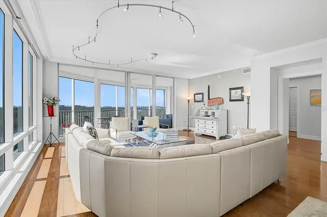 a kitchen with granite countertop white cabinets and appliances
