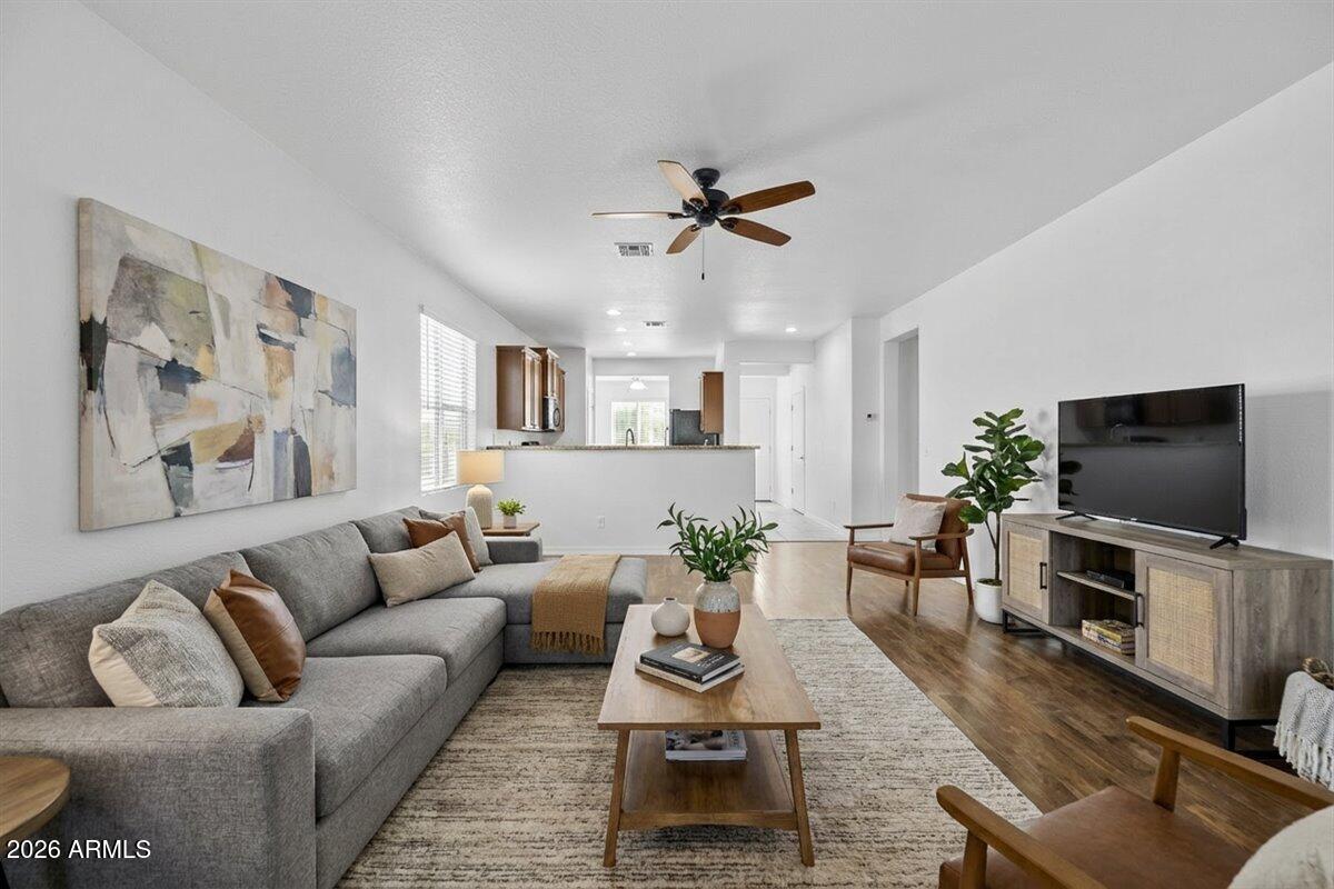 4366 West White Canyon Road San Tan Valley, AZ 85144 - Photo 11 of 35 a living room with furniture and a flat screen tv