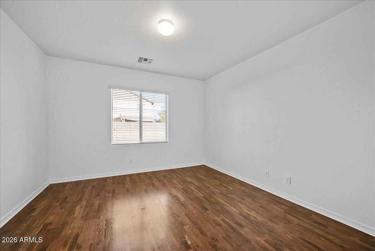 4366 West White Canyon Road San Tan Valley, AZ 85144 - Photo 18 of 35 an empty room with wooden floor and windows