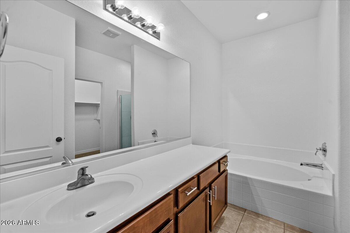 4366 West White Canyon Road San Tan Valley, AZ 85144 - Photo 21 of 35 a bathroom with a sink double vanity and a bathtub