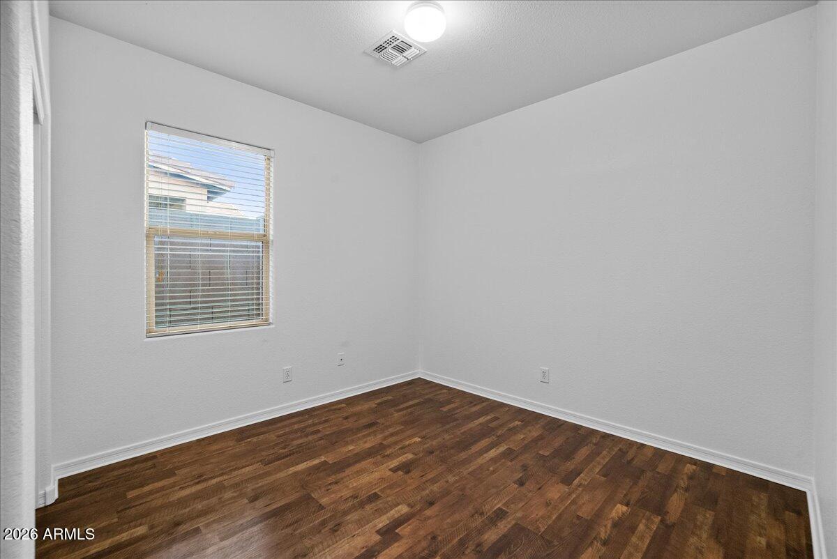 4366 West White Canyon Road San Tan Valley, AZ 85144 - Photo 24 of 35 a view of an empty room with wooden floor and a window
