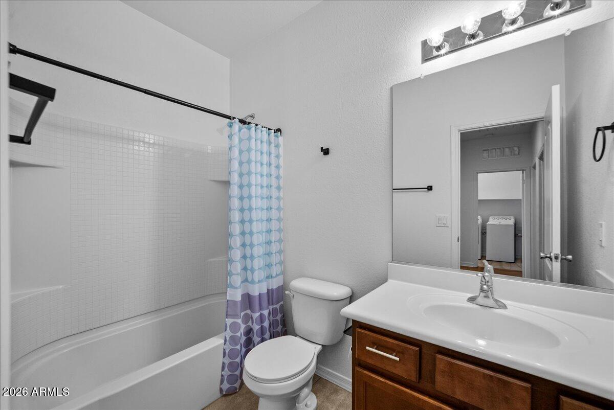 4366 West White Canyon Road San Tan Valley, AZ 85144 - Photo 25 of 35 a bathroom with a sink a toilet a mirror and shower