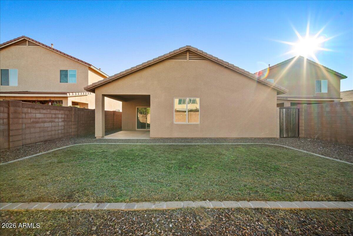 4366 West White Canyon Road San Tan Valley, AZ 85144 - Photo 29 of 35 a view of a house with a yard