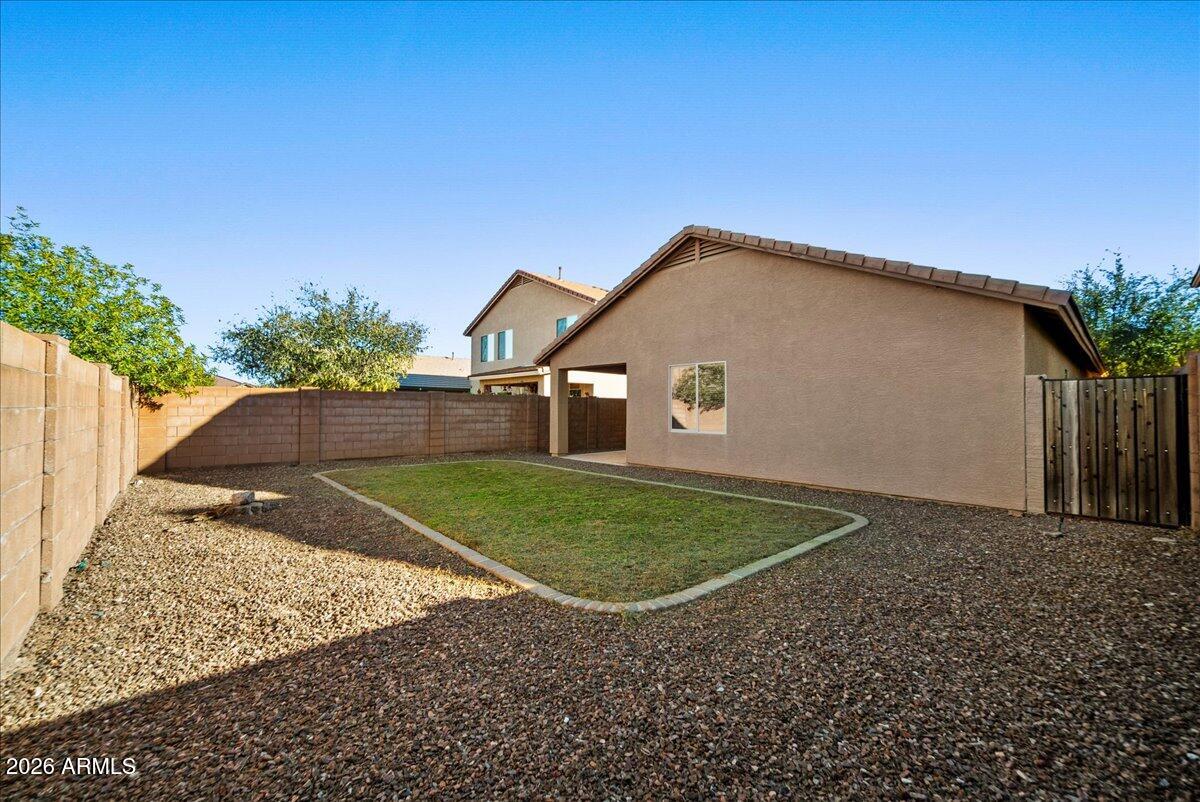 4366 West White Canyon Road San Tan Valley, AZ 85144 - Photo 30 of 35 a front view of a house with a yard