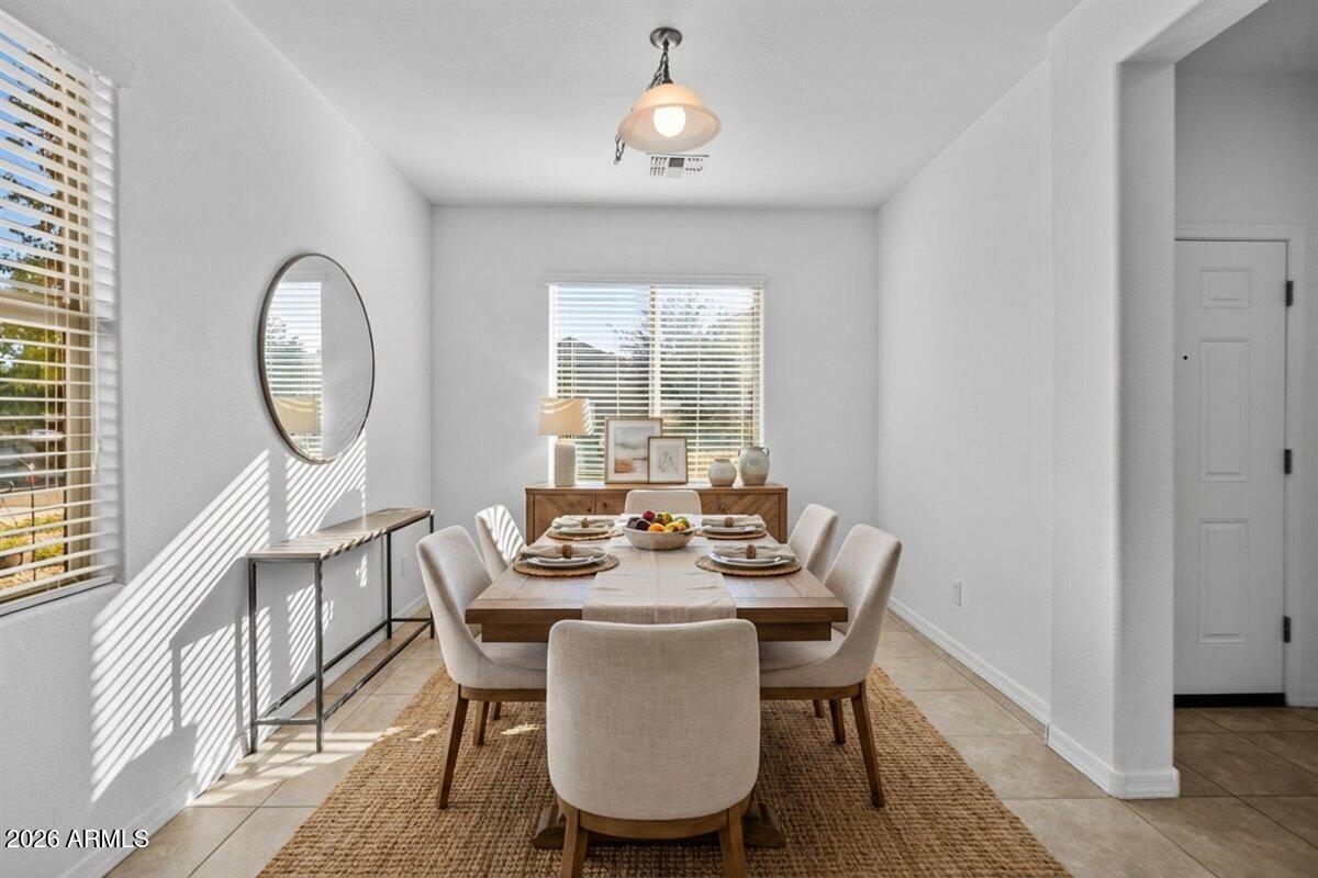 4366 West White Canyon Road San Tan Valley, AZ 85144 - Photo 7 of 35 a view of a dining room with furniture window and wooden floor