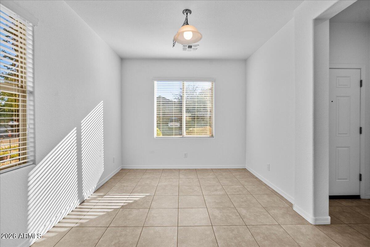 4366 West White Canyon Road San Tan Valley, AZ 85144 - Photo 8 of 35 wooden floor in an empty room with a window