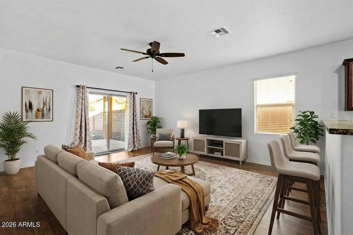 4366 West White Canyon Road San Tan Valley, AZ 85144 - Photo 9 of 35 a living room with furniture wooden floor and a flat screen tv