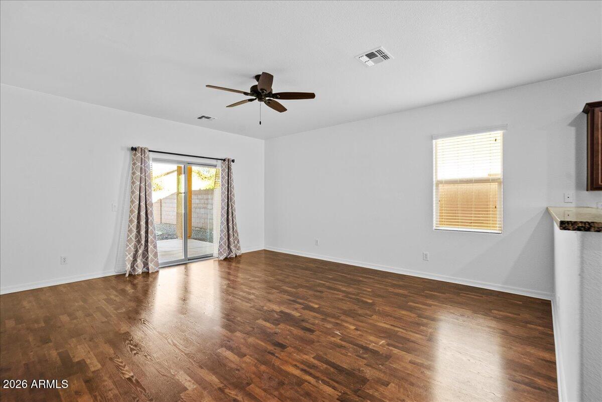 4366 West White Canyon Road San Tan Valley, AZ 85144 - Photo 10 of 35 a view of empty room with wooden floor and fan