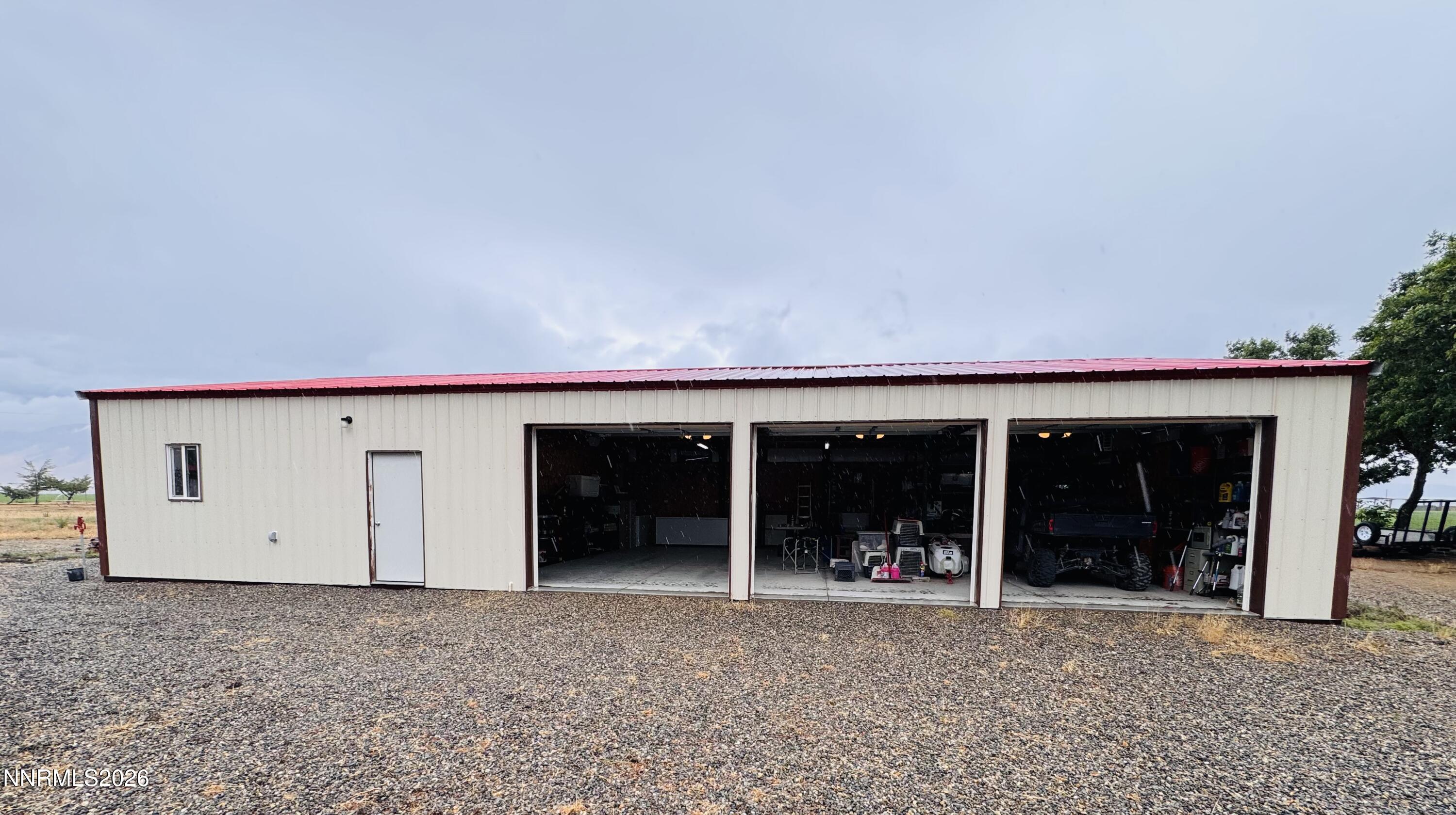 29400 Kings River Road Orovada, NV 89425 - Photo 26 of 40 a view of a house with a yard and a garage