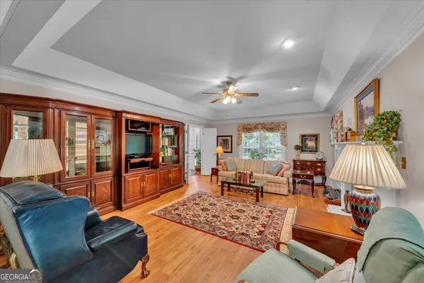 a dining room with furniture and wooden floor
