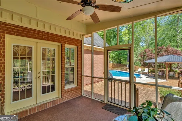 a backyard of a house with lots of green space and trees all around