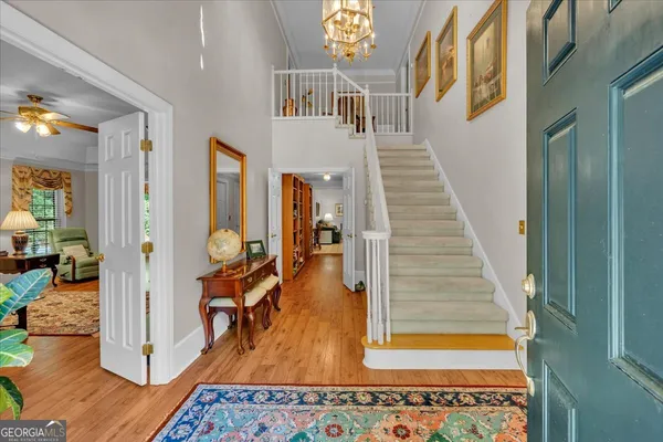 a living room with furniture fireplace and large window
