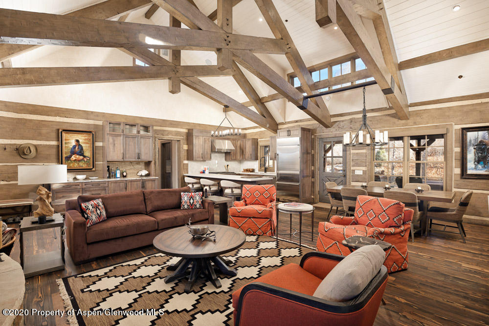 14 Arbaney Ranch Road Basalt, CO 81621 - Photo 2 of 29 a living room with furniture and a chandelier