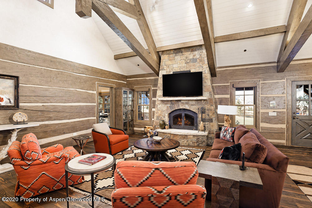 14 Arbaney Ranch Road Basalt, CO 81621 - Photo 4 of 29 a living room with furniture a fireplace and a flat screen tv