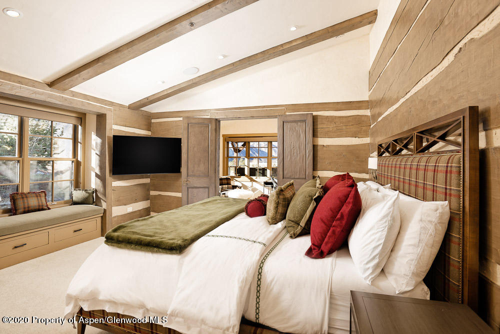 14 Arbaney Ranch Road Basalt, CO 81621 - Photo 8 of 29 a bedroom with a bed and a flat screen tv