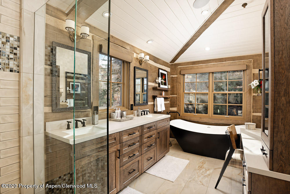 14 Arbaney Ranch Road Basalt, CO 81621 - Photo 9 of 29 a large bathroom with a double vanity sink a mirror and a bathtub