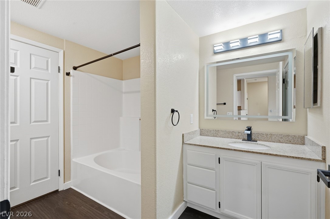 10550 West Alexander Road, Unit 2177 Las Vegas, NV 89129 - Photo 9 of 19 This clean bathroom includes a tub and vanity, creating a refreshing space for daily routines.