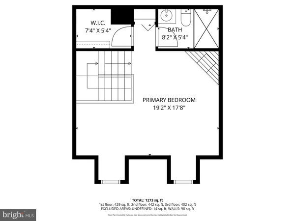 a picture of a bench in front of a wall