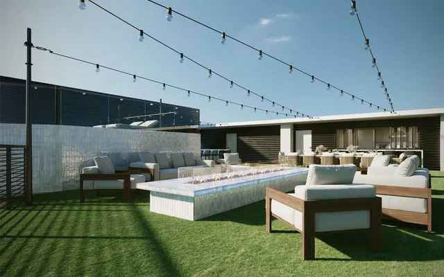a view of a terrace with chairs and outdoor kitchen