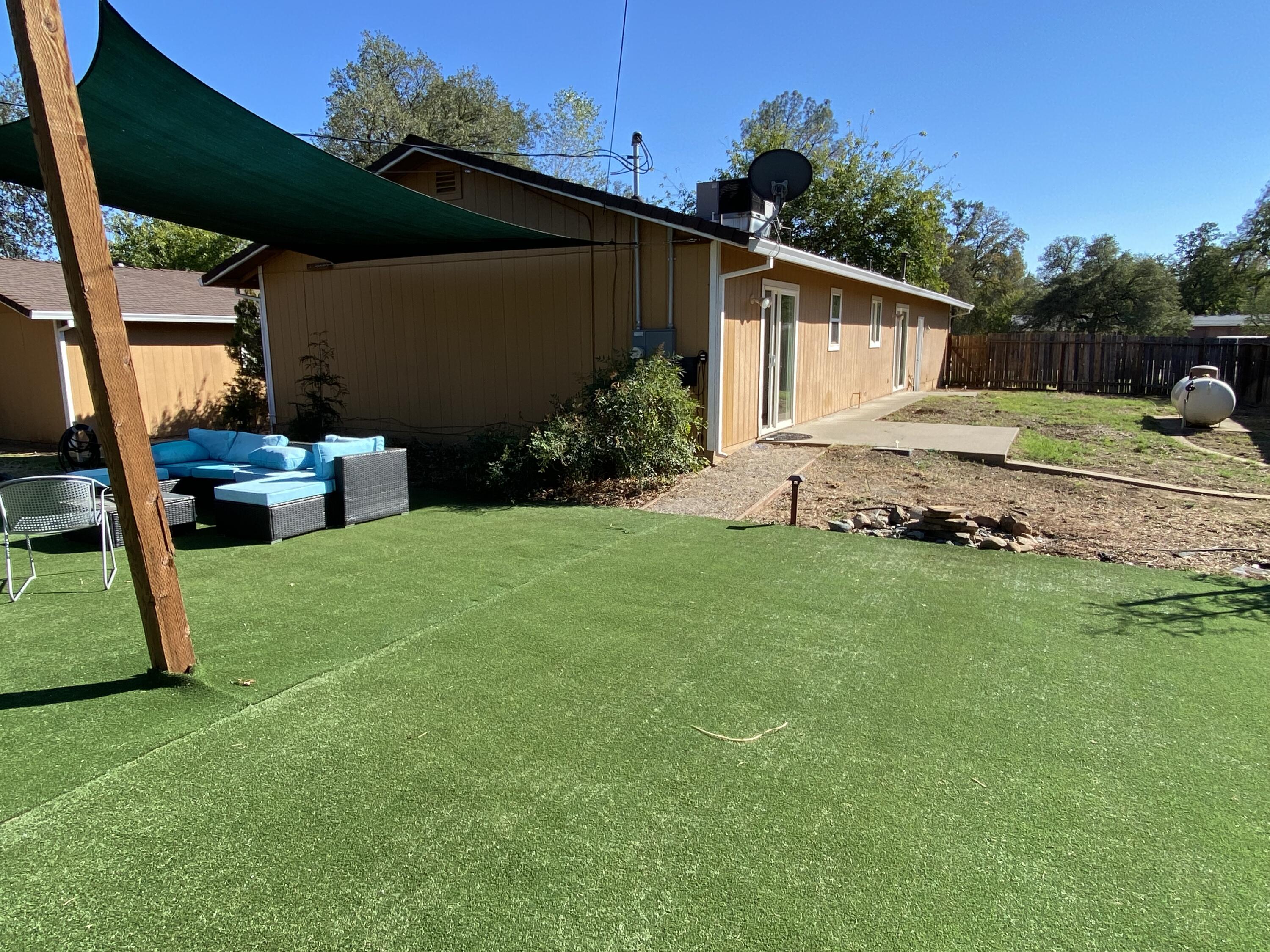 18602 Old Oasis Road Redding, CA 96003 - Photo 16 of 23 a view of a house with backyard and sitting area