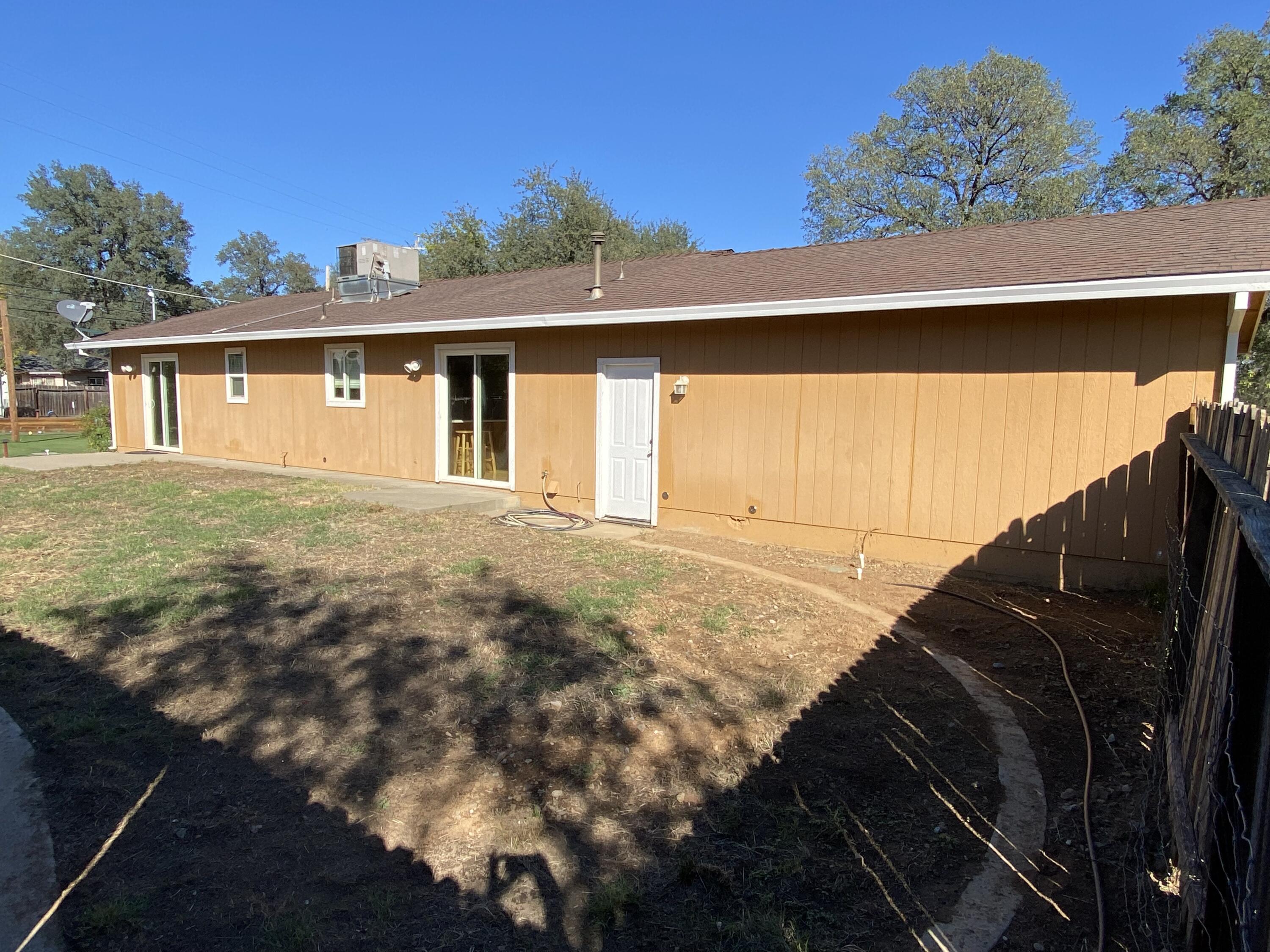 18602 Old Oasis Road Redding, CA 96003 - Photo 18 of 23 a view of a house with a backyard