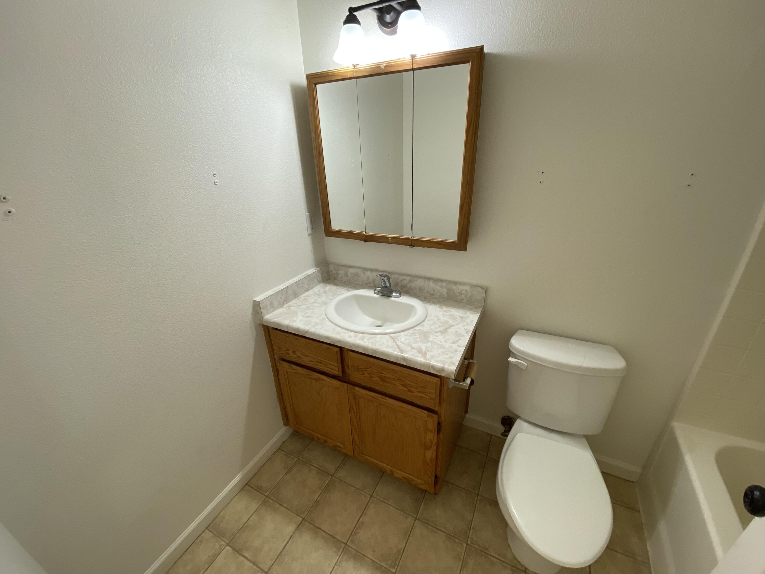 18602 Old Oasis Road Redding, CA 96003 - Photo 9 of 23 a bathroom with a toilet sink and mirror