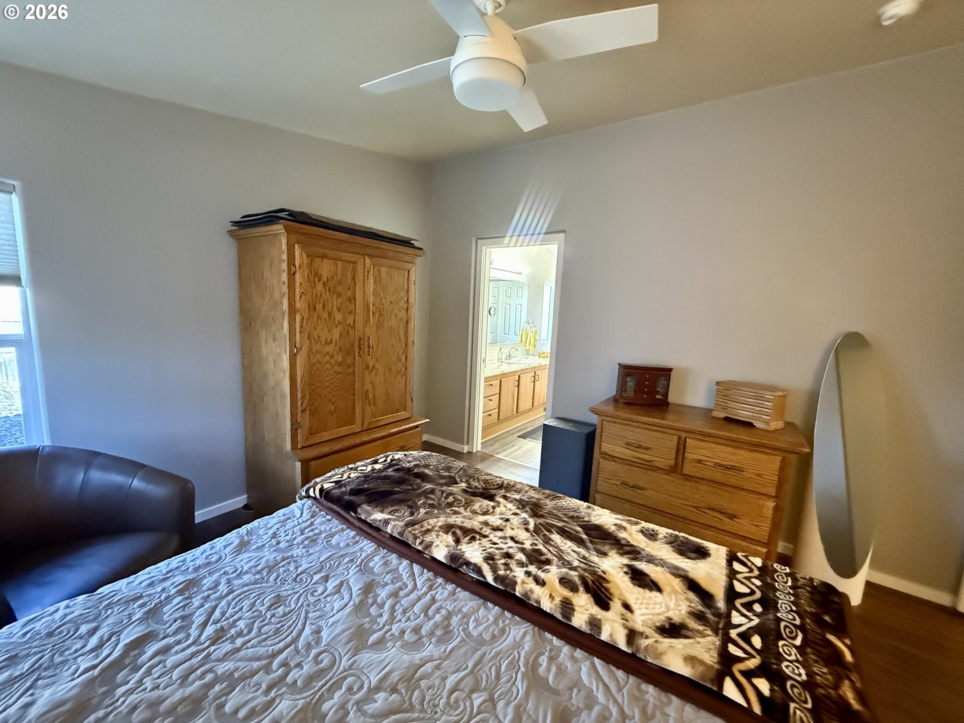 3050 Knott Terrace Coos Bay, OR 97420 - Photo 11 of 24 a bedroom with a bed and wooden floor