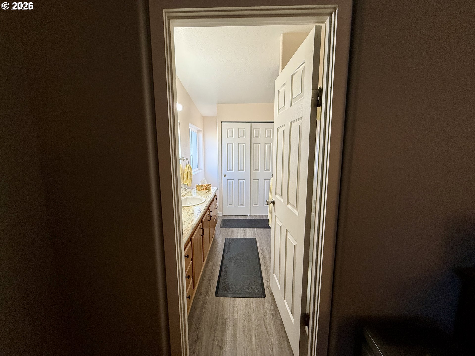 3050 Knott Terrace Coos Bay, OR 97420 - Photo 13 of 24 a view of a hallway with wooden floor and a door