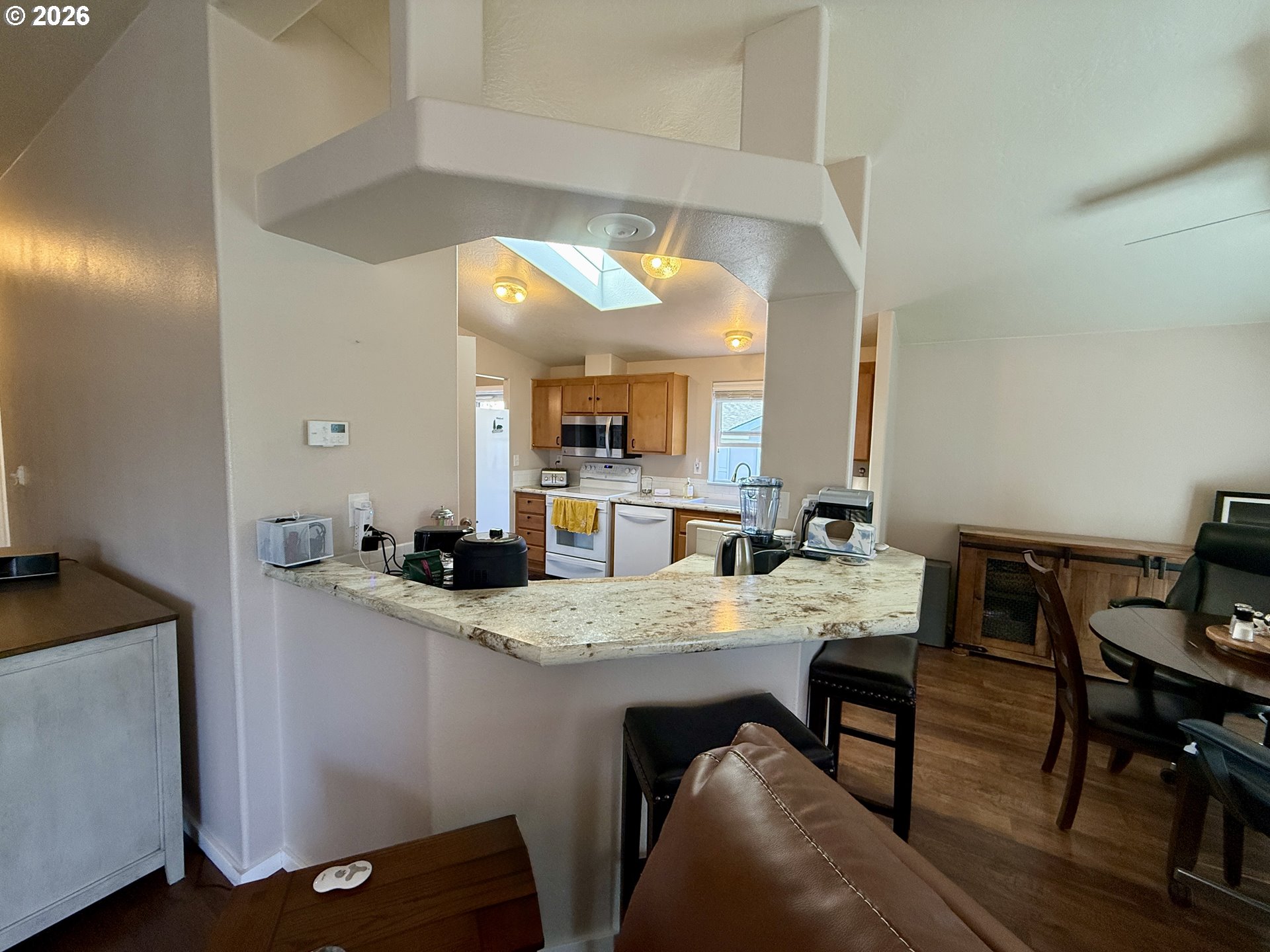 3050 Knott Terrace Coos Bay, OR 97420 - Photo 20 of 24 a kitchen with a table and chairs in it