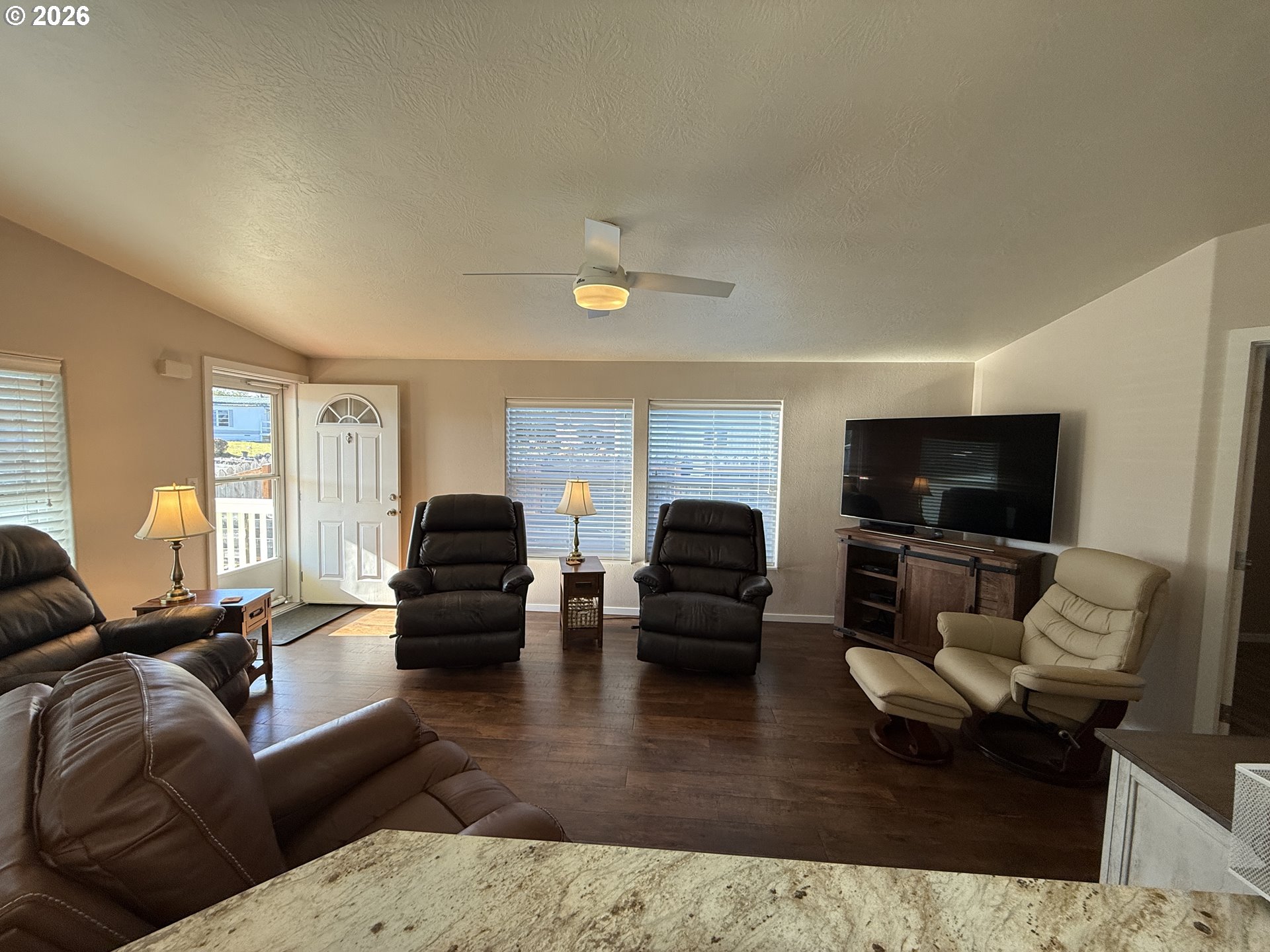 3050 Knott Terrace Coos Bay, OR 97420 - Photo 4 of 24 a living room with furniture and a flat screen tv