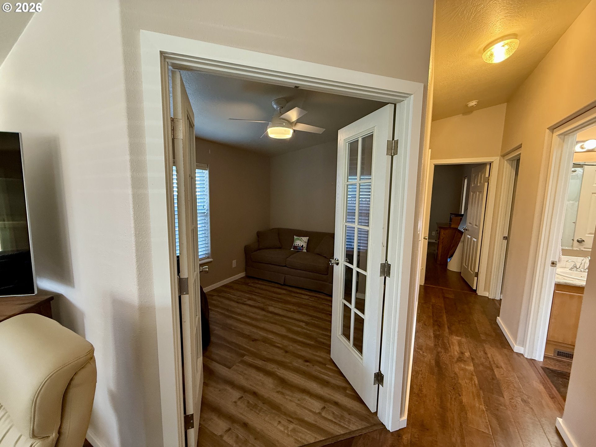3050 Knott Terrace Coos Bay, OR 97420 - Photo 6 of 24 a view of a hallway with wooden floor and staircase