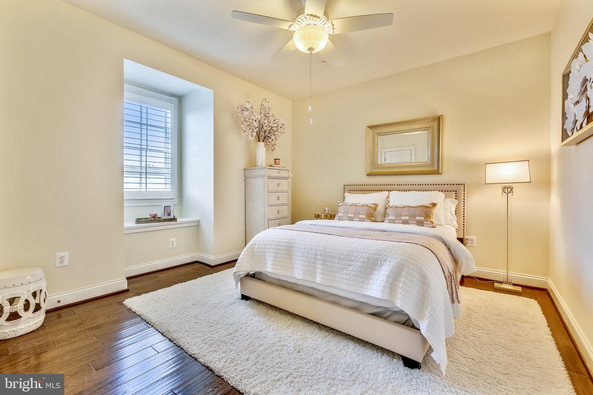 1411 Ridgeview Way Washington, DC 20007 - Photo 33 of 43 a bedroom with a bed and wooden floor