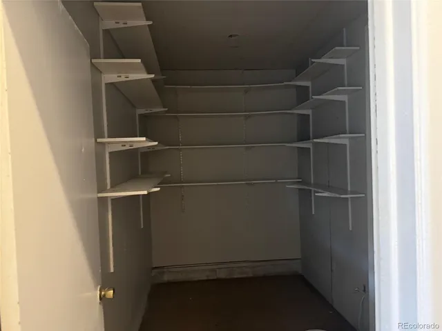a view of an empty walk in closet