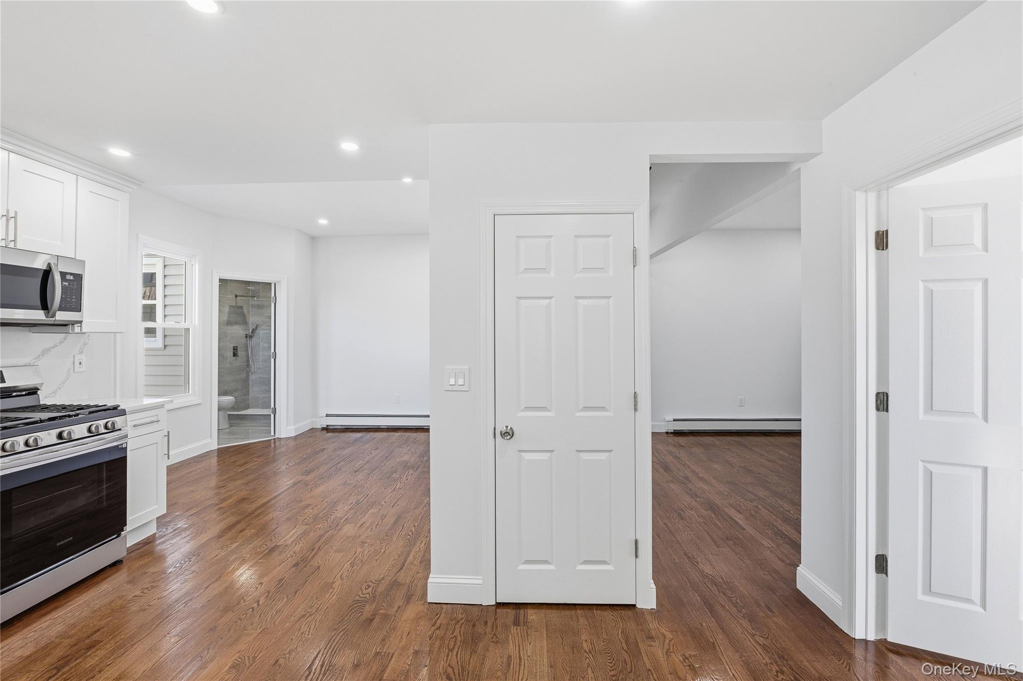 22 Colonial Avenue Freeport, NY 11520 - Photo 22 of 41 a view of a kitchen with wooden floor and electronic appliances