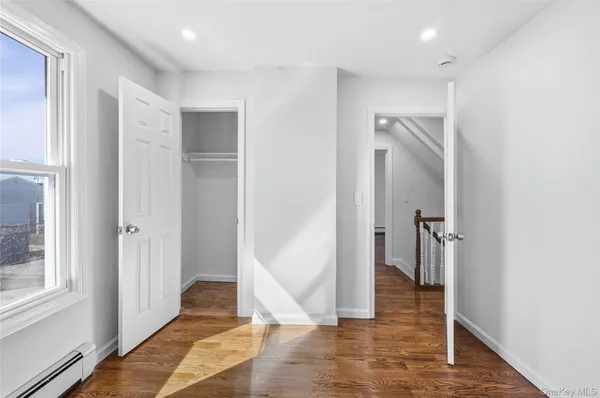 a view of entryway with wooden floor
