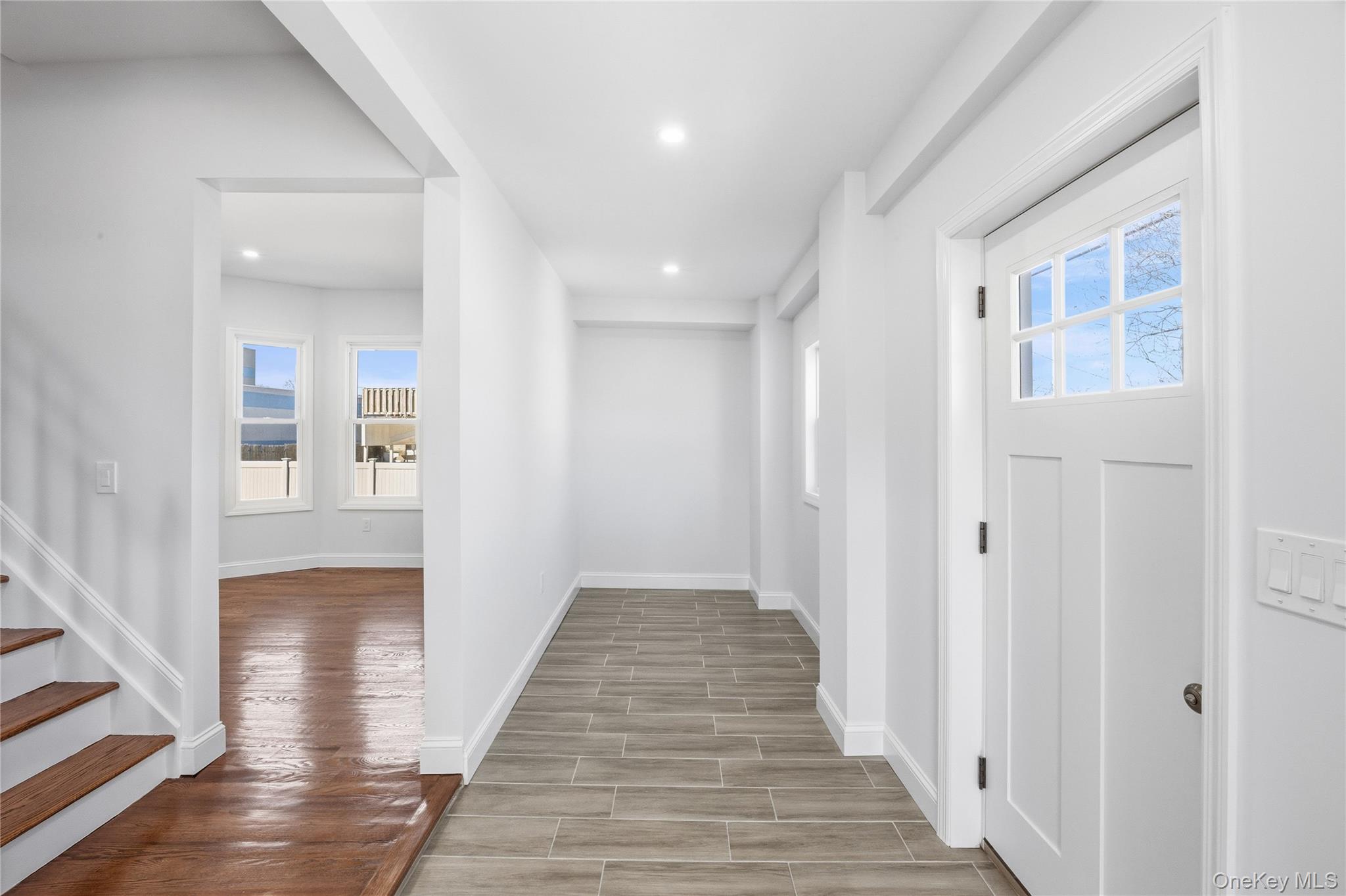 22 Colonial Avenue Freeport, NY 11520 - Photo 7 of 41 a view of a hallway with wooden floor