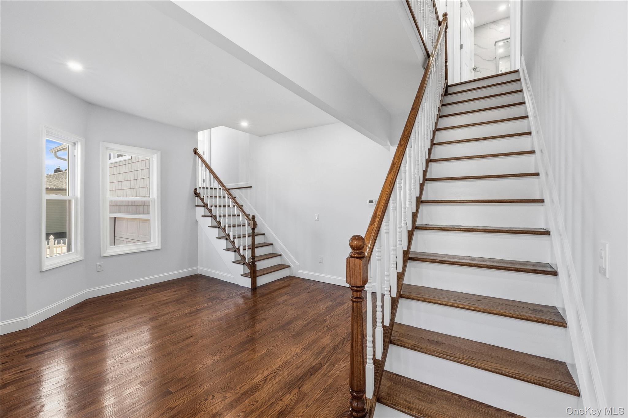 22 Colonial Avenue Freeport, NY 11520 - Photo 9 of 41 a view of entryway with wooden floor and stairs