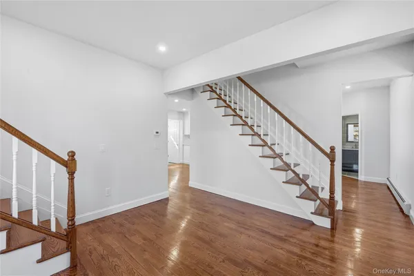 a view of entryway with wooden floor