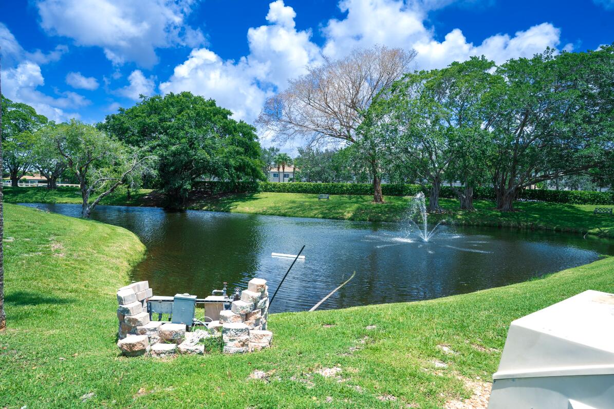 5458 Via Delray Boulevard, Unit 110 Delray Beach, FL 33484 - Photo 11 of 30 a lake view with a garden