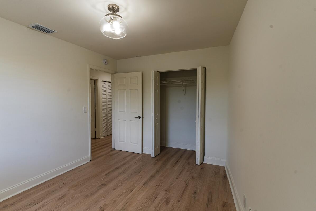 5458 Via Delray Boulevard, Unit 110 Delray Beach, FL 33484 - Photo 21 of 30 wooden floor in an empty room with a window