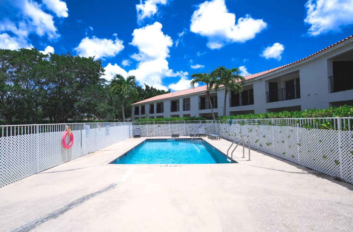 5458 Via Delray Boulevard, Unit 110 Delray Beach, FL 33484 - Photo 10 of 30 a view of swimming pool with a yard