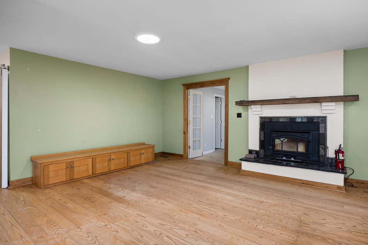5815 Paragon Circle Durham, NC 27712 - Photo 11 of 41 a view of an empty room with a fireplace