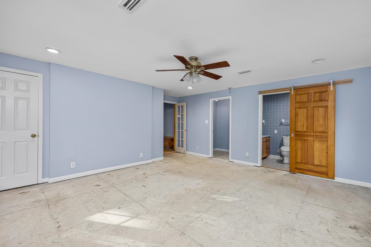 5815 Paragon Circle Durham, NC 27712 - Photo 12 of 41 a view of a livingroom with a ceiling fan & entryway