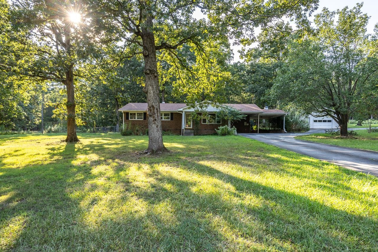 5815 Paragon Circle Durham, NC 27712 - Photo 2 of 41 a view of a house with swimming pool and a yard