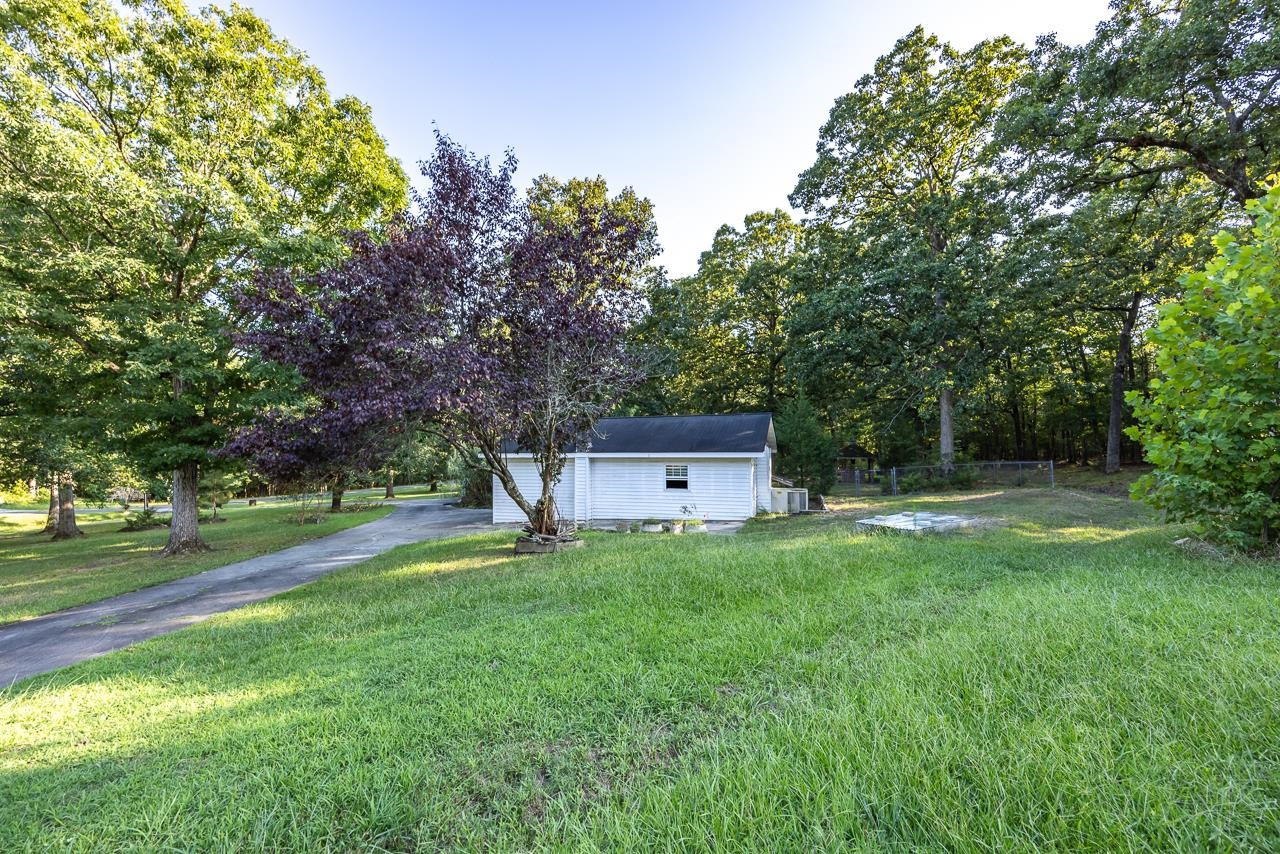 5815 Paragon Circle Durham, NC 27712 - Photo 33 of 41 a house view with a sitting space and garden