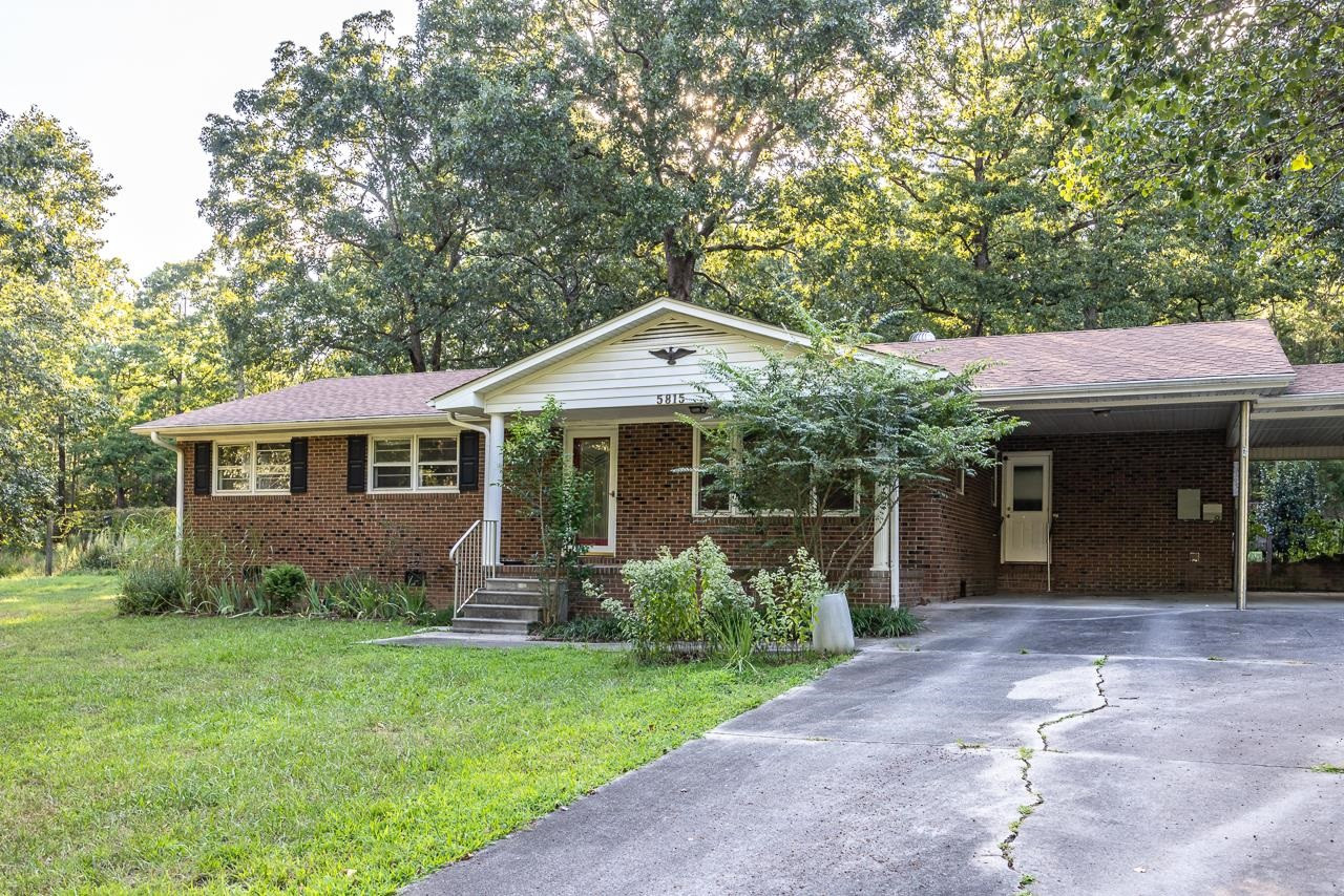 5815 Paragon Circle Durham, NC 27712 - Photo 35 of 41 a front view of a house with garden