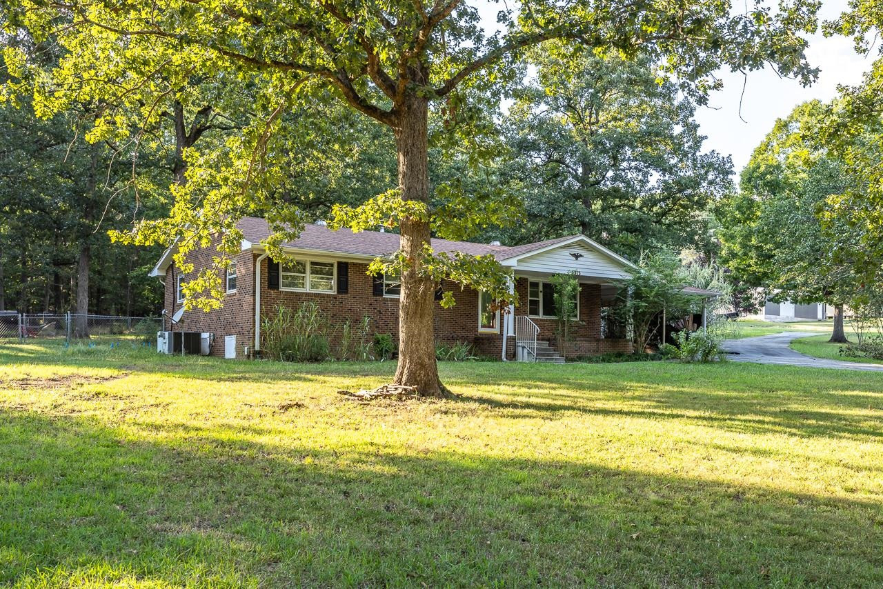5815 Paragon Circle Durham, NC 27712 - Photo 4 of 41 a front view of a house with a yard table and chairs