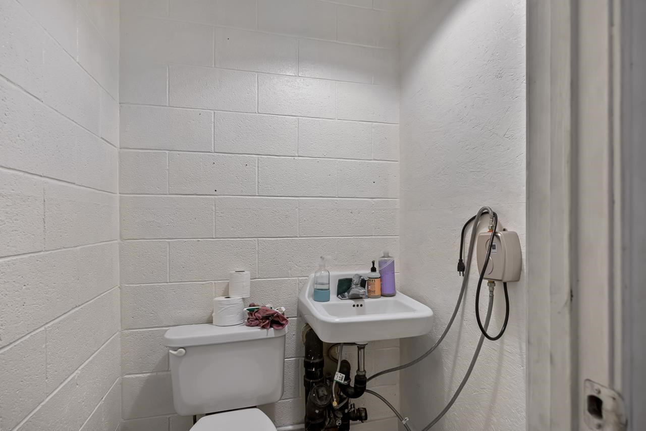 5815 Paragon Circle Durham, NC 27712 - Photo 41 of 41 a bathroom with a sink toilet and shower