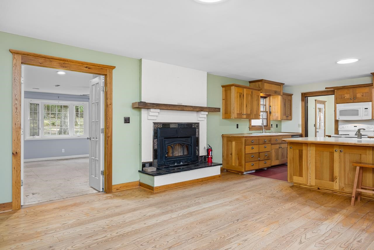 5815 Paragon Circle Durham, NC 27712 - Photo 10 of 41 a view of a livingroom with a fireplace and window