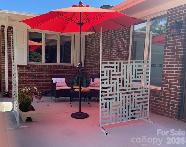 100 Chapel Road Black Mountain, NC 28711 - Photo 11 of 30 a view of a chairs with an umbrella in backyard